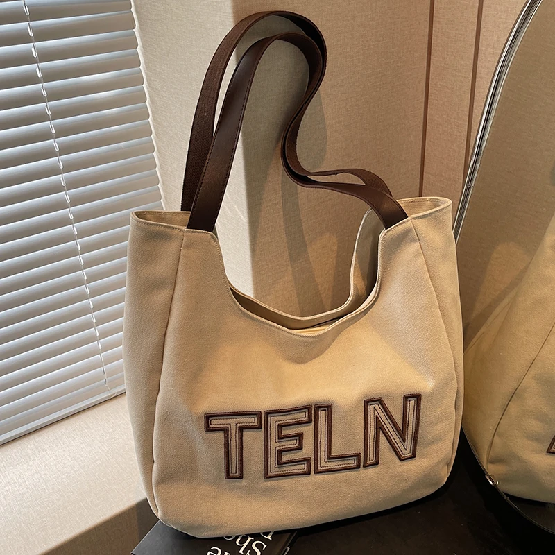 文艺韩版时尚托特包女2025新款百搭简约大容量帆布包通勤单肩女包