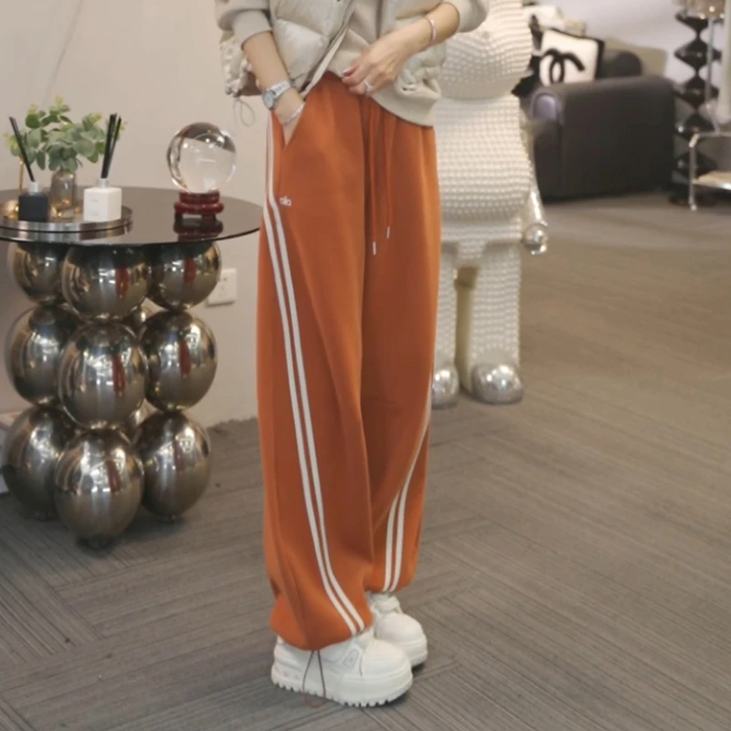 2025秋冬加绒加厚保暖休闲裤女弯刀裤百搭束脚裤卫裤LK2507729