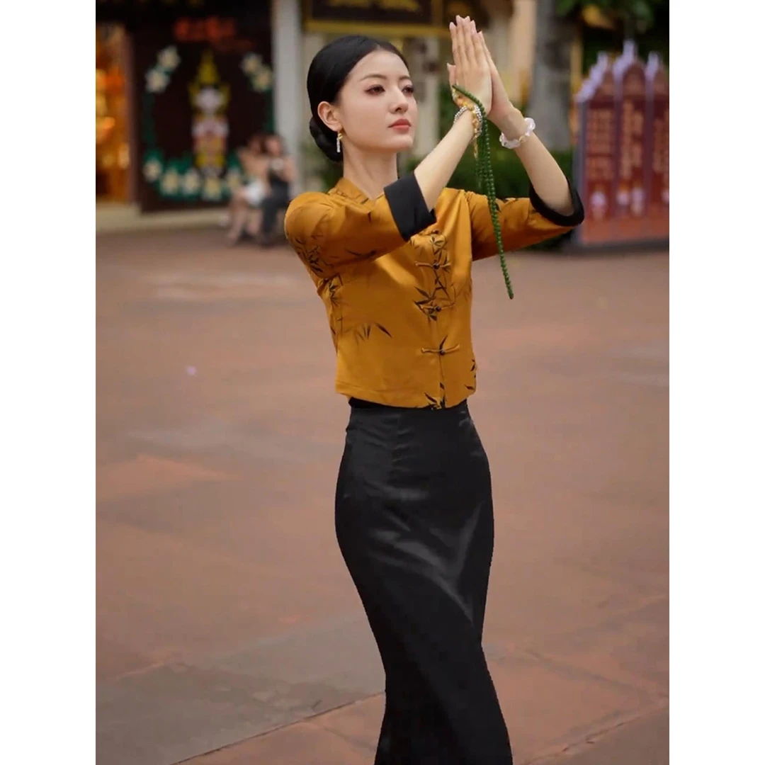 新中式国风女装2025新款巨好看气质高级感黄色上衣黑色半身裙套装