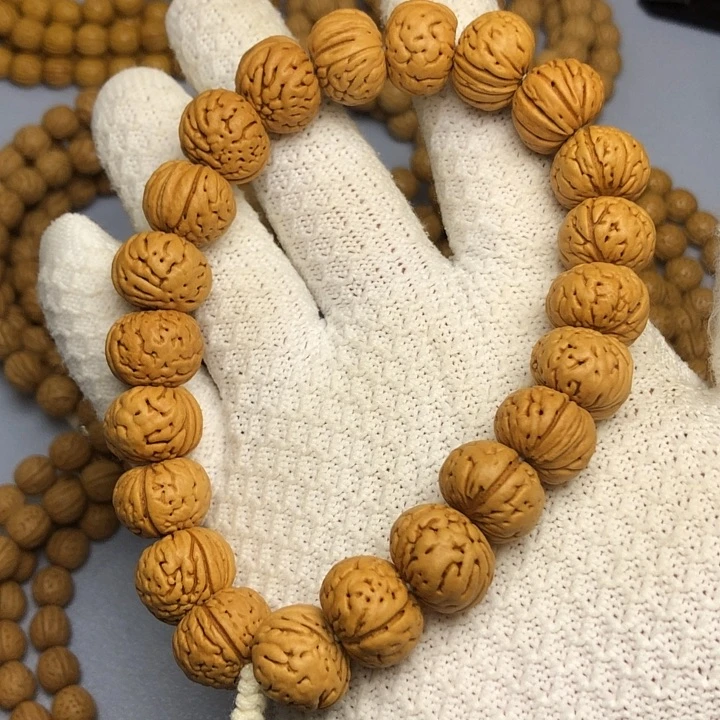 桃核吊坠树王纽扣手持