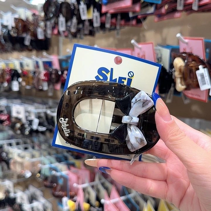 茶色灰色蝴蝶结贝壳夹