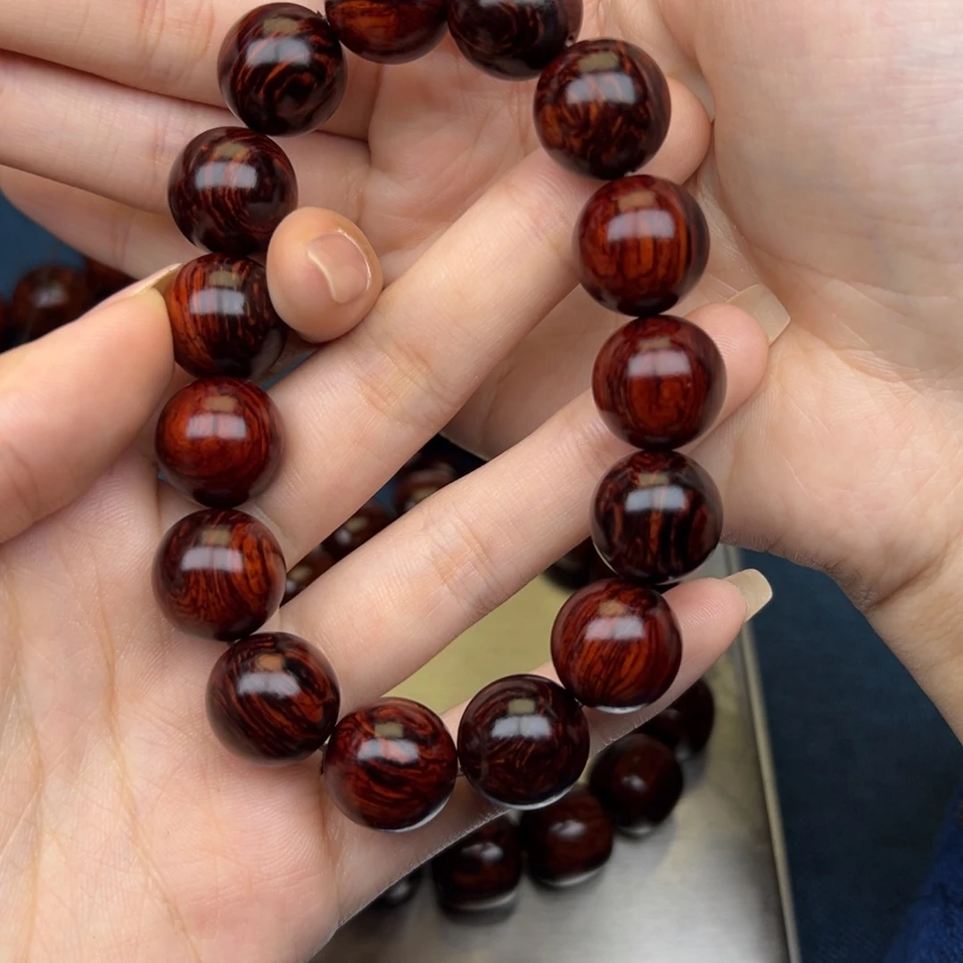 顾***三花梨木类手串/手链红降15圆珠满油单圈（疤痕瑕疵）038