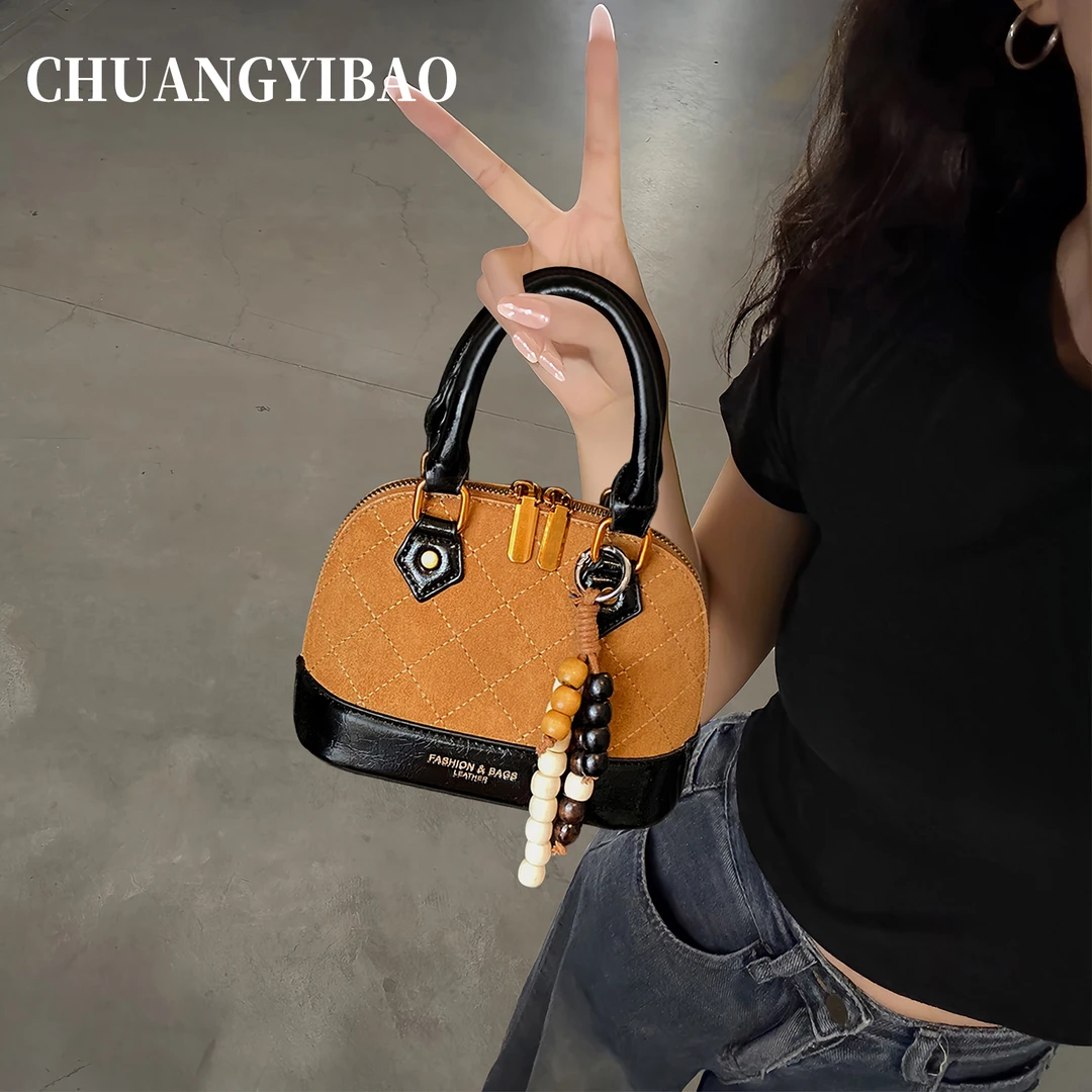 高级感麂皮手提包女2025新款秋冬质感通勤贝壳包小众休闲斜挎小包