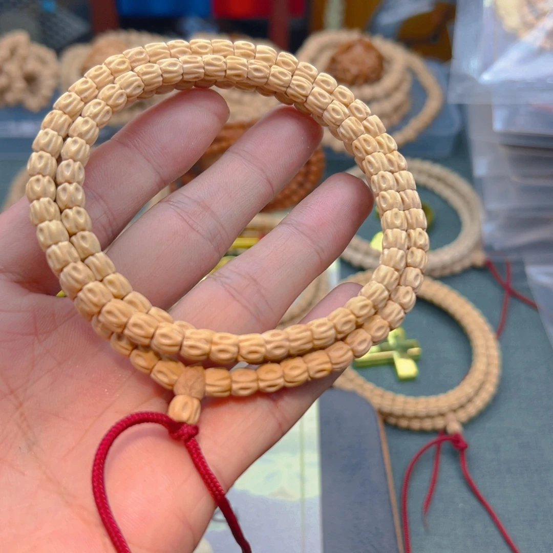 丁***计柏香籽/百香籽吊坠