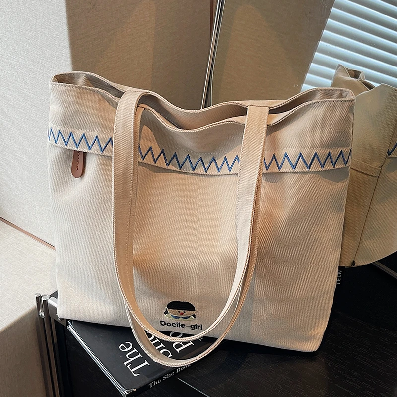 刺绣帆布包女大容量2025新款秋冬百搭休闲单肩包大学生上课托特包