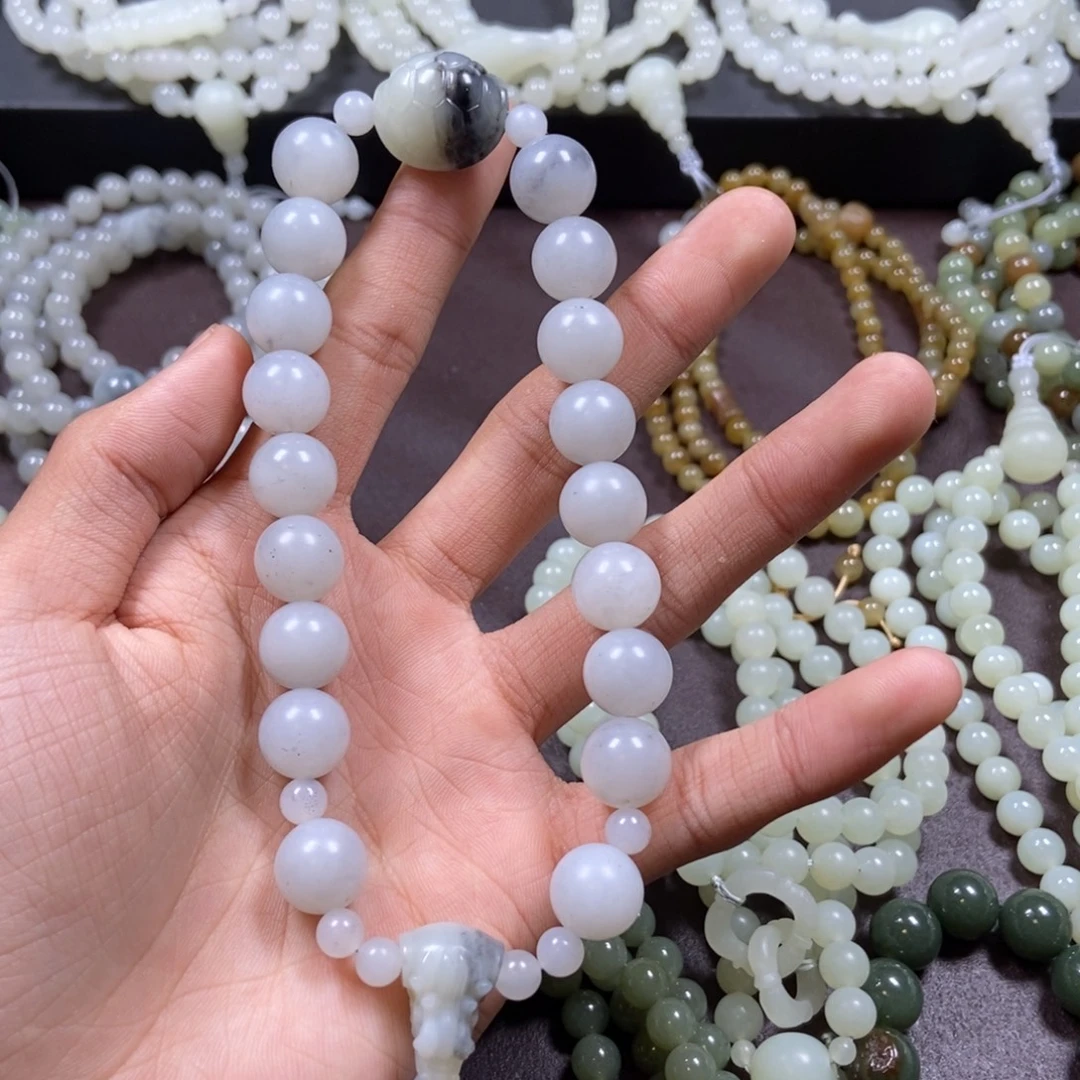 松***布和田玉未镶嵌把件