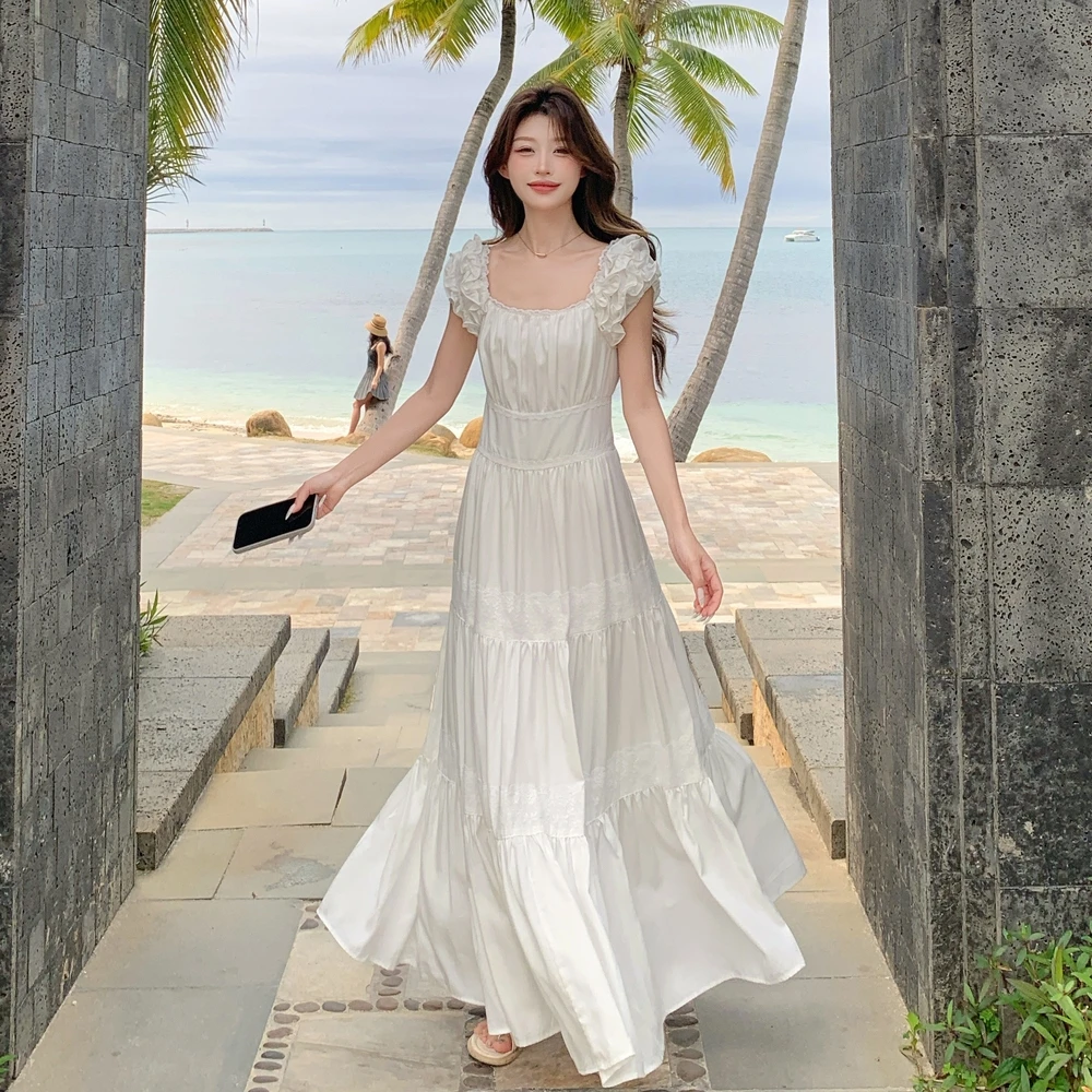 木耳边白色小飞袖连衣裙女夏季2025新款法式吊带裙超仙蛋糕长裙