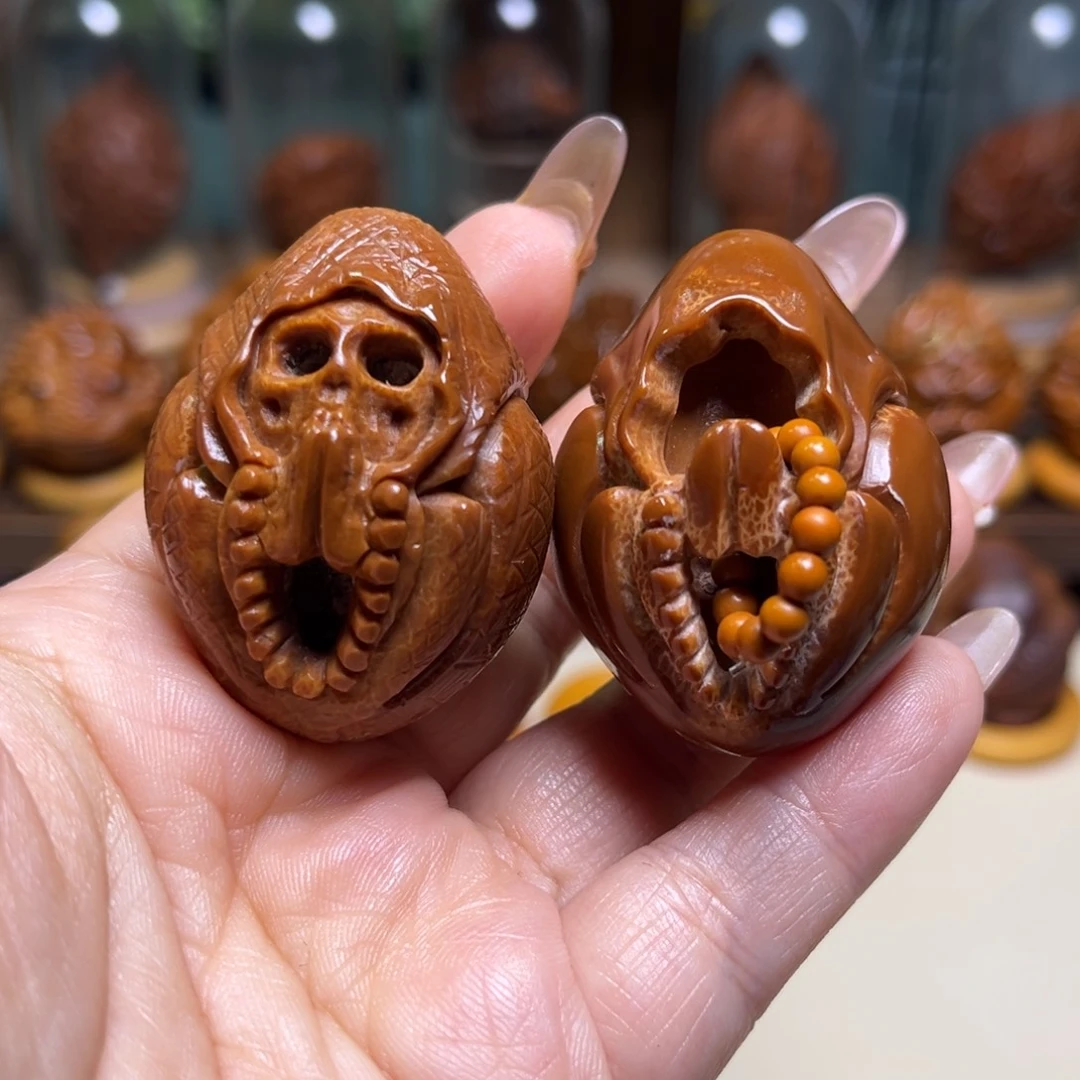 橄榄核把件镂空死神无相一对