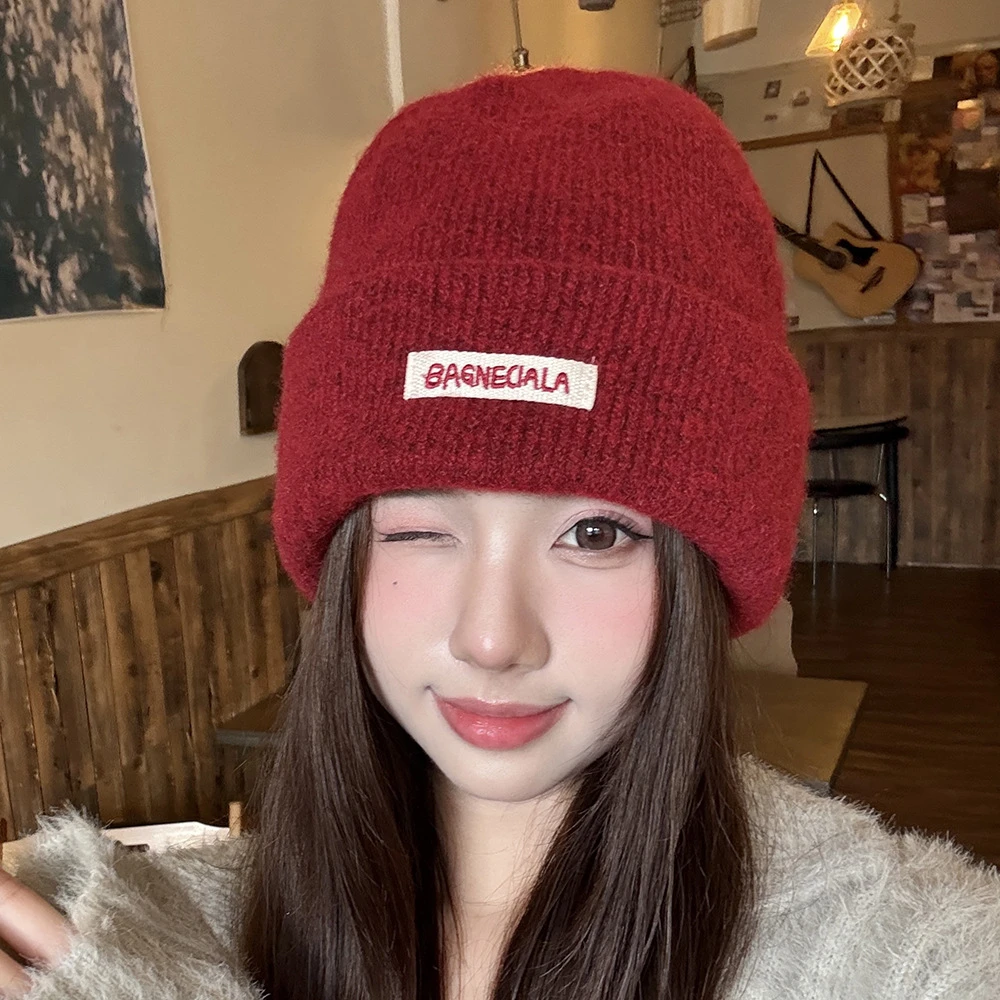 新款时尚字母长标针织帽男女秋冬百搭保暖毛线帽子户外防寒护耳帽