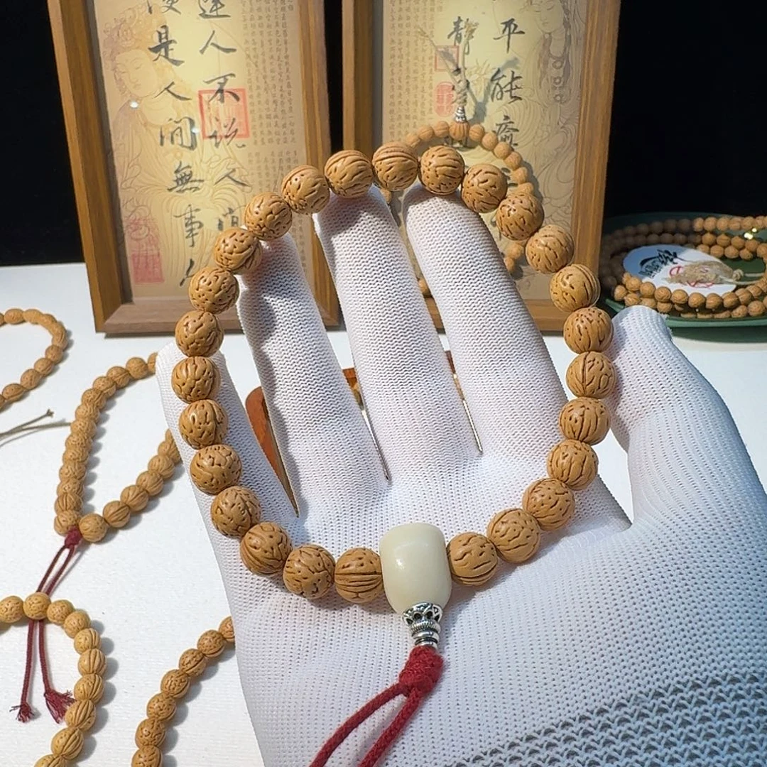 悠***笑吊坠桃核野生小黄桃