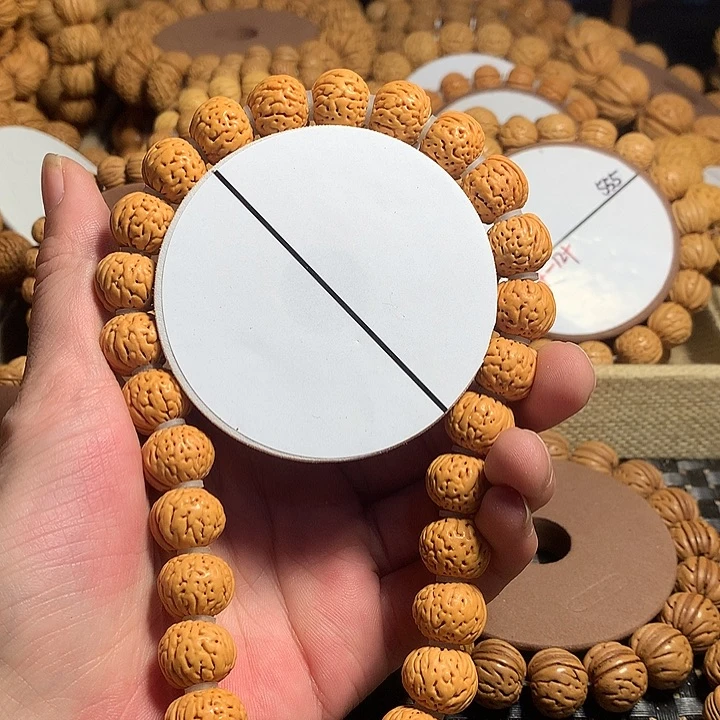 ༄***༅桃核手串11#东北野生龙纹元宝手持