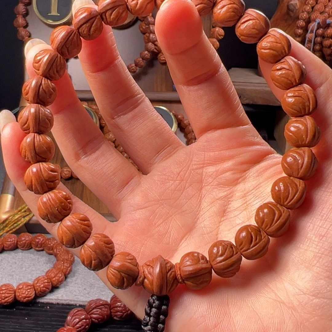 桃核手串11玉麒麟野生