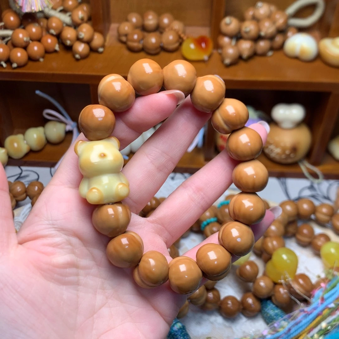 陈****吊坠猴头核桃新款屁桃手串小熊