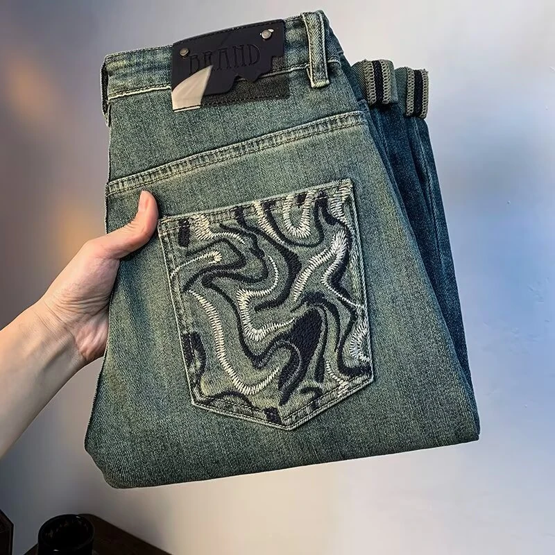 春夏新款潮流牛仔裤男士韩版修身百搭高档欧若风刺绣休闲九分长裤