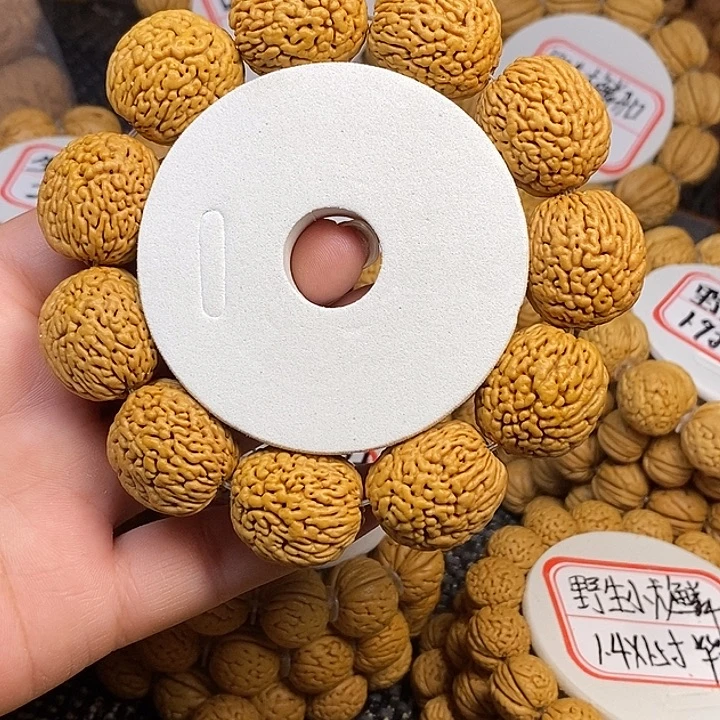 时***转桃核手串野生钱袋子21