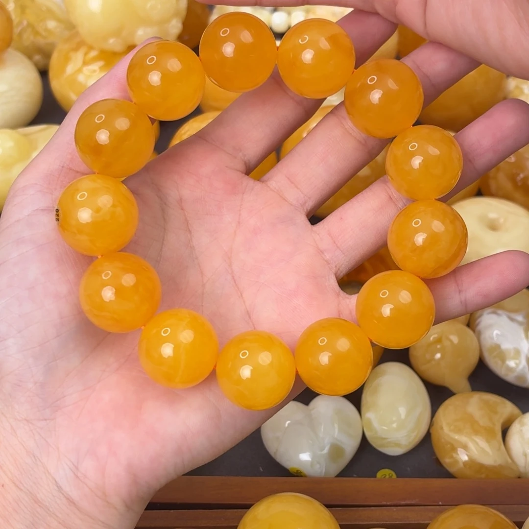 重***跑裸石虫珀未镶嵌橘红手串