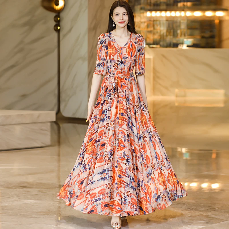 黄色印花连衣裙女2025新款夏季高端时尚气质修身显瘦沙滩大摆长裙