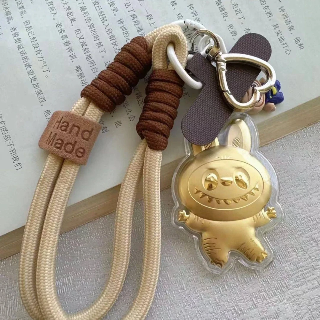 足金999棕色拉布布手机挂包挂