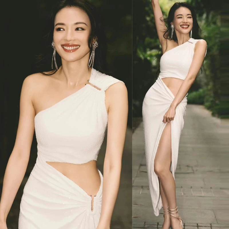 明星舒淇同款白色斜肩镂空连衣裙设计感不规则度假风女神开叉裙