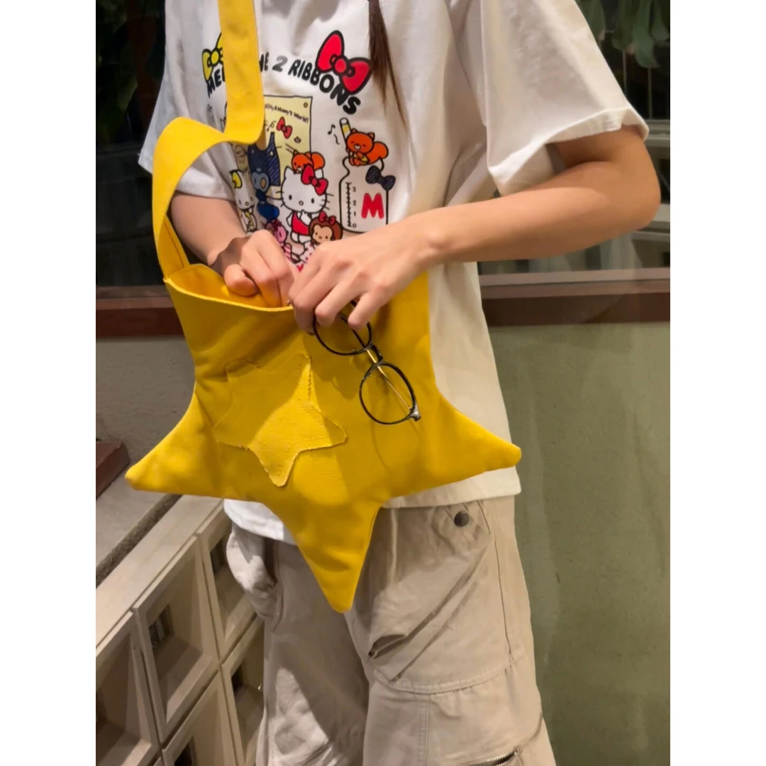 韩系可爱黄色星星帆布包女2025新款便携单肩包小众通勤斜挎托特包
