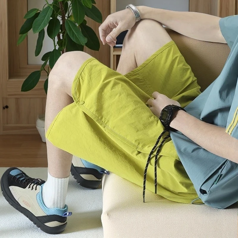 排扣运动短裤男女款夏季薄款速干沙滩裤子潮流大码宽松休闲五分裤