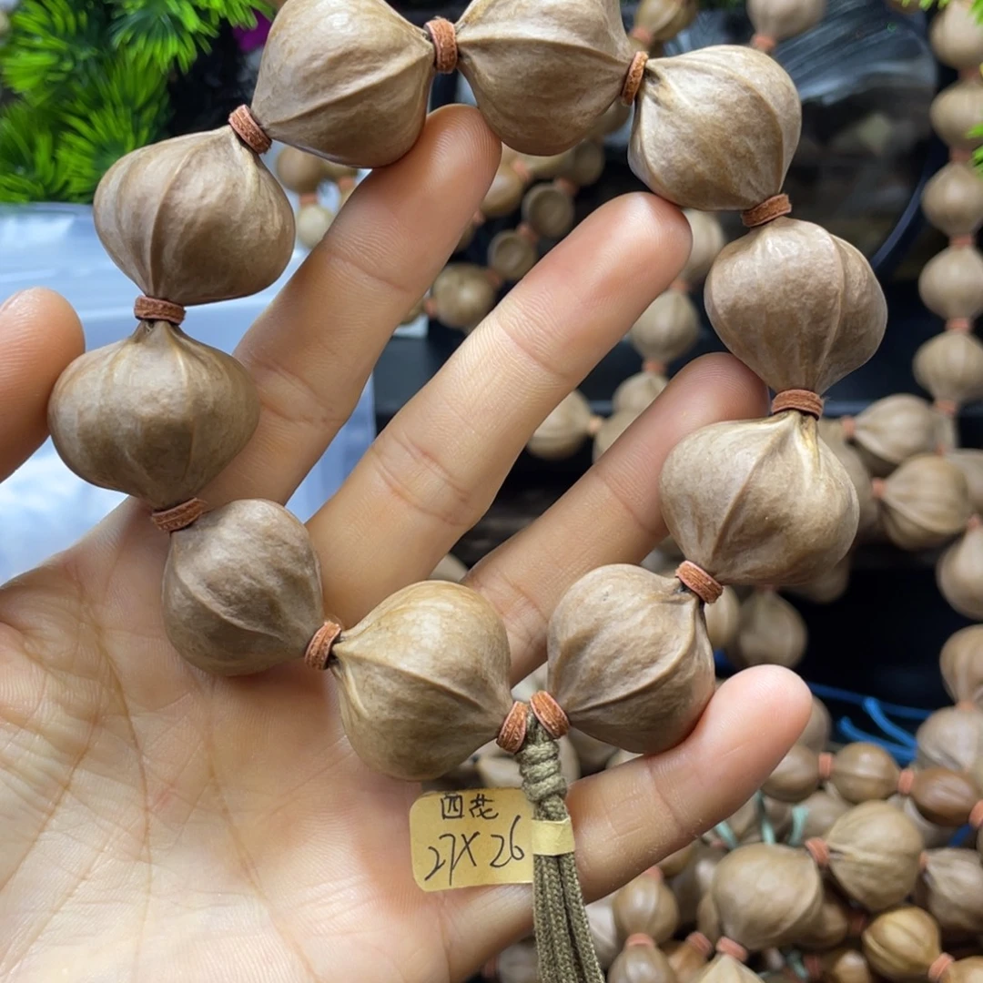 苏***叔吊坠橄榄核2726四花铁核