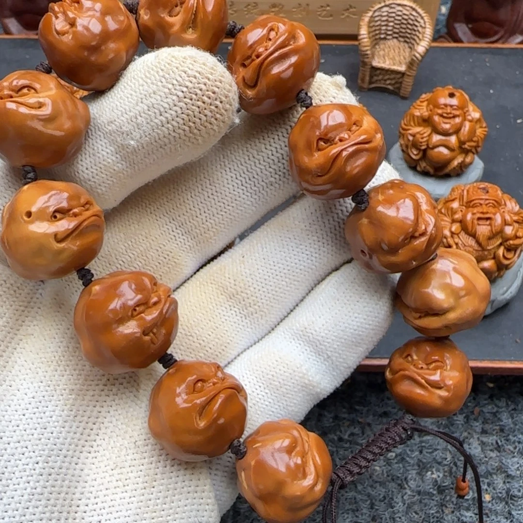 橄榄核吊坠呱呱来财