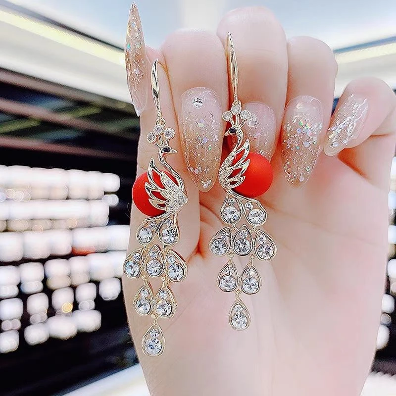 铜合金仿珍珠耳饰 银针超闪超仙孔雀耳环女精致长款喜庆礼服耳饰