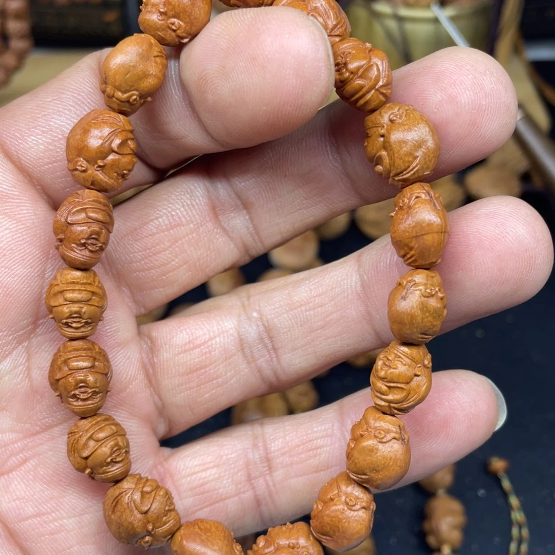 龙纹桃核雕刻财神手串
