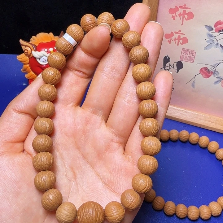 扬***吊坠猴头核桃凤羽