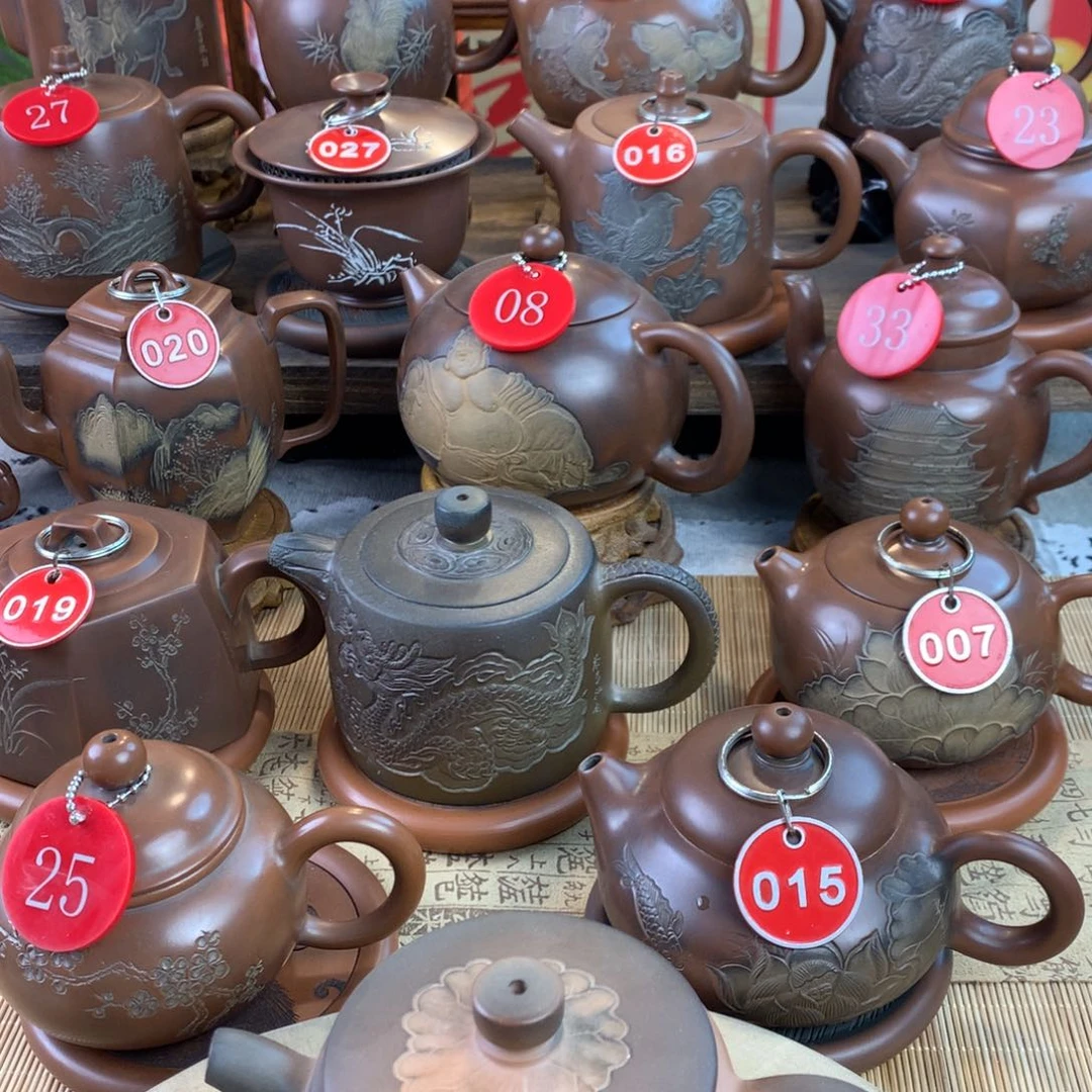 云**裳坭兴陶手工刻绘汉瓦荷花壶