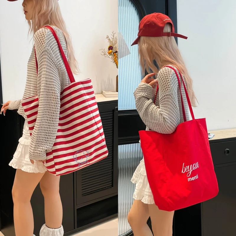 128大容量双面包包条纹气质文艺少女日常通勤百搭单肩腋下包AB面