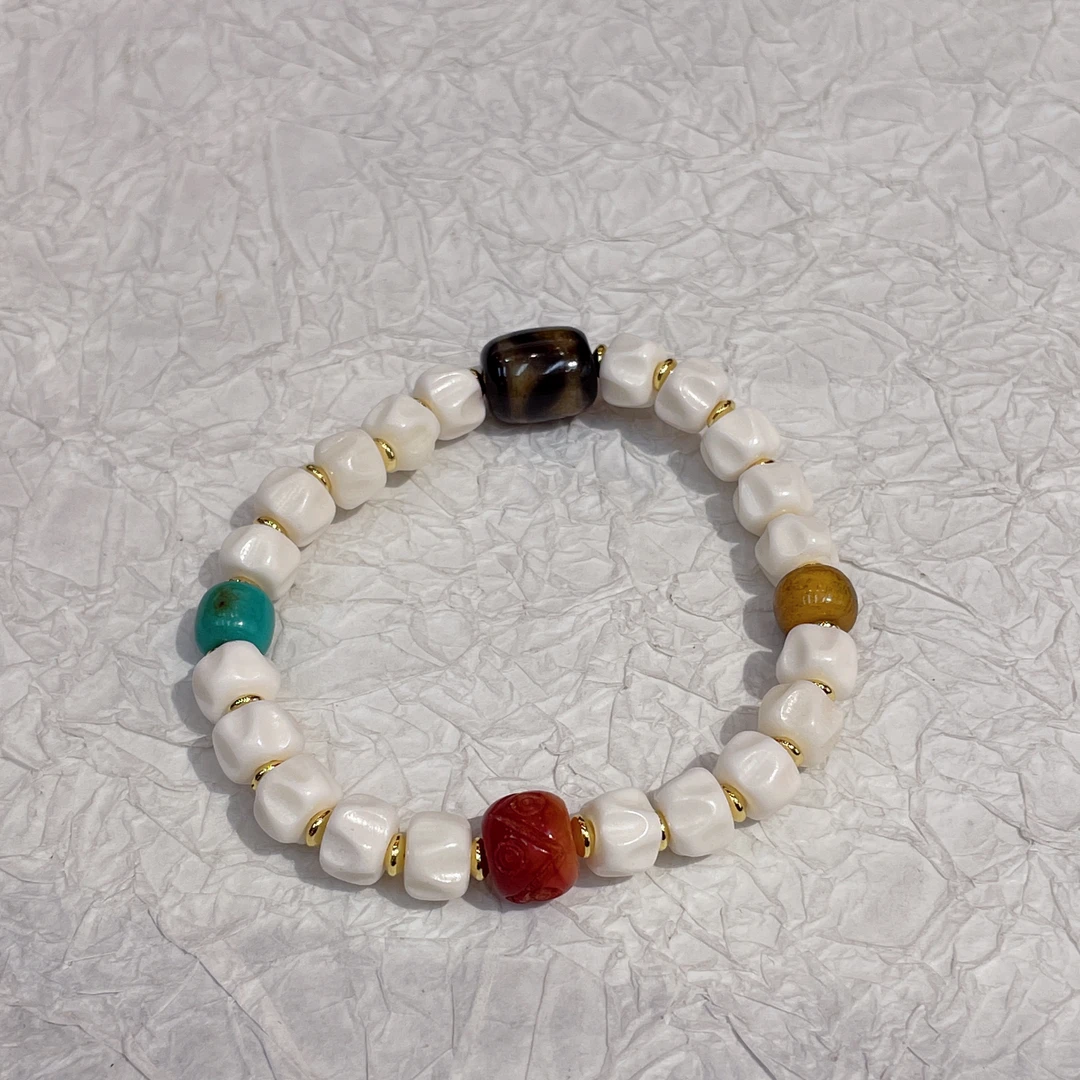 铜合金手链 17554 驼骨百香籽+小松雕刻小红 天小珠 串