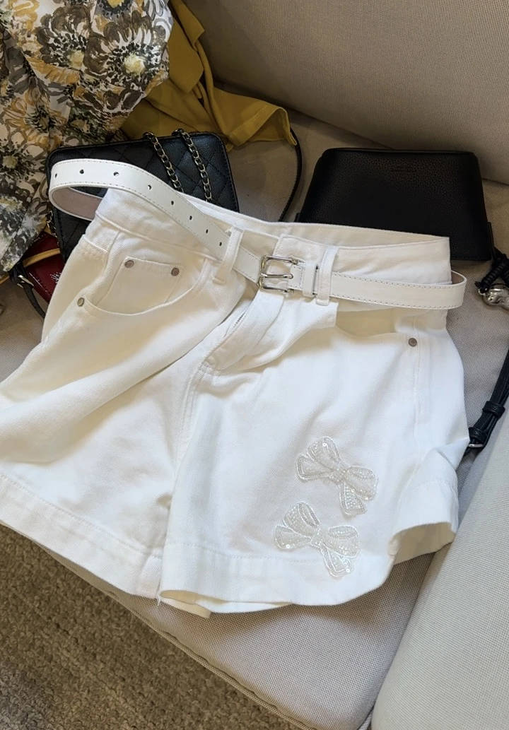 Nalian/拿恋豆子优选-高腰显瘦白色蝴蝶结镶钻牛仔短裤   DZ98031