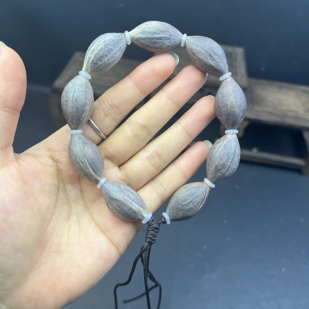 橄榄核雕原皮素核纯天然生长紫皮核自然桩素串