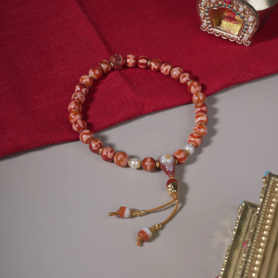 【藏经博物馆】丨红肉达洛多宝天珠手持多样性发其一