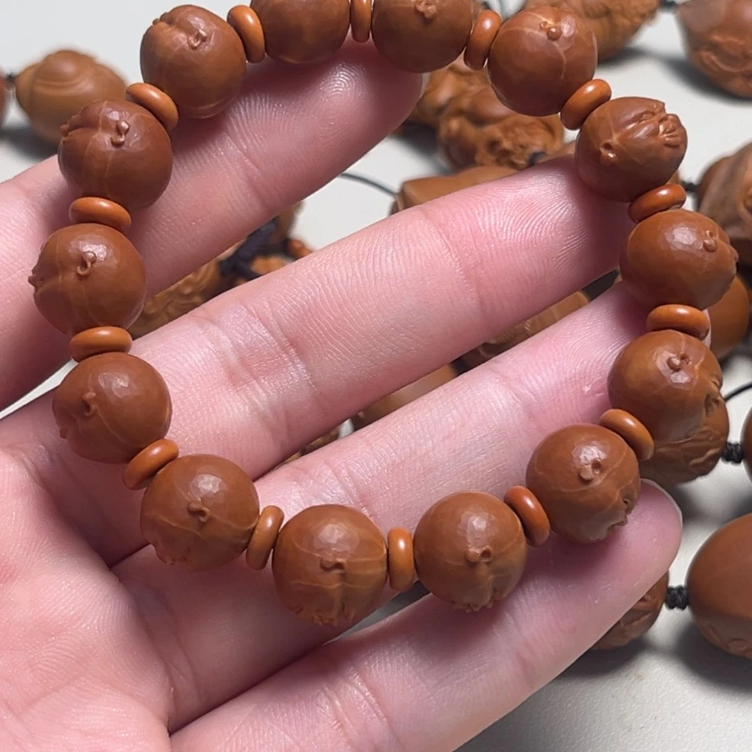 橄榄核吊坠五****?人生百态