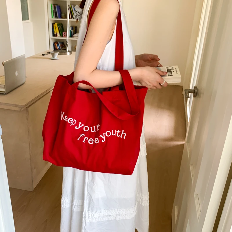 字母帆布包包女2025新款潮夏季时尚托特包学院风大容量单肩布包