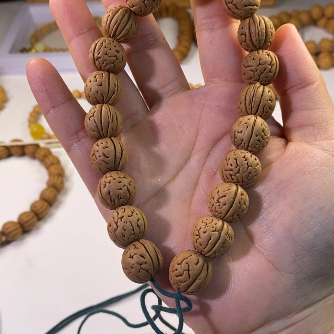 阿***尚桃核吊坠桃核手串巨石