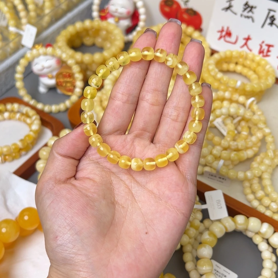 郑***雨琥珀未镶嵌手链7.5mm 半珀半蜜
