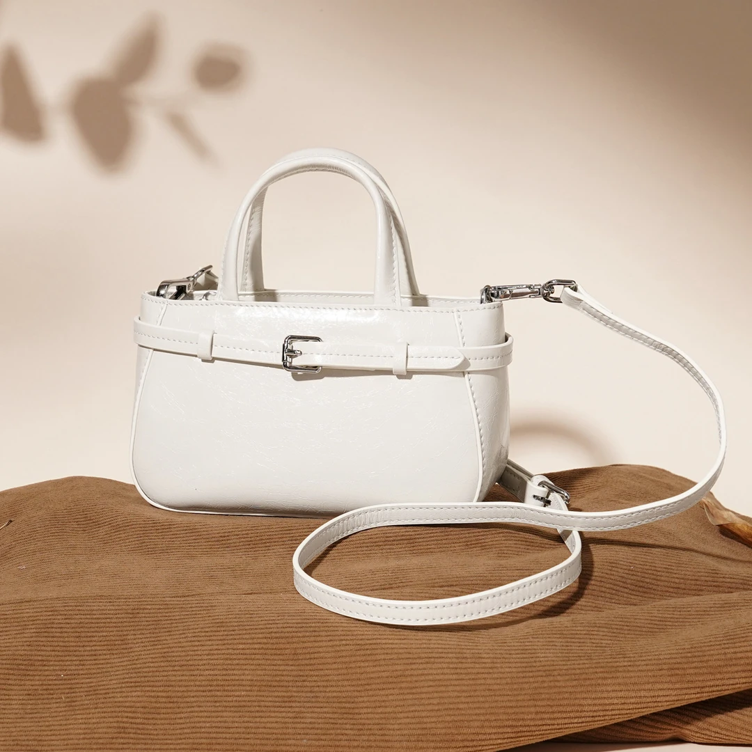 岩牛2025夏季新款小众手提包轻奢百搭女士斜挎复古肩包YN3577