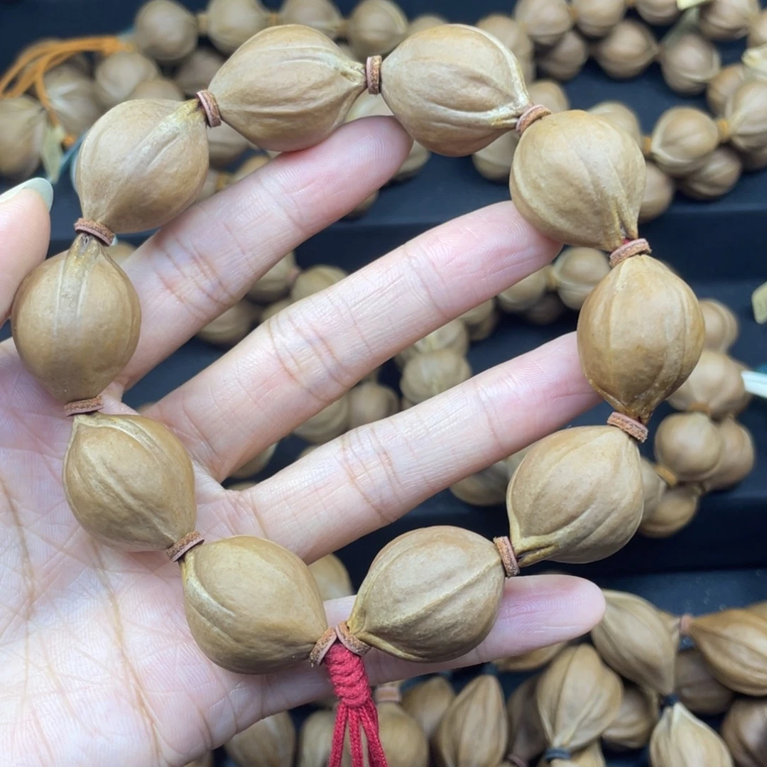 ****004橄榄核三花21*27