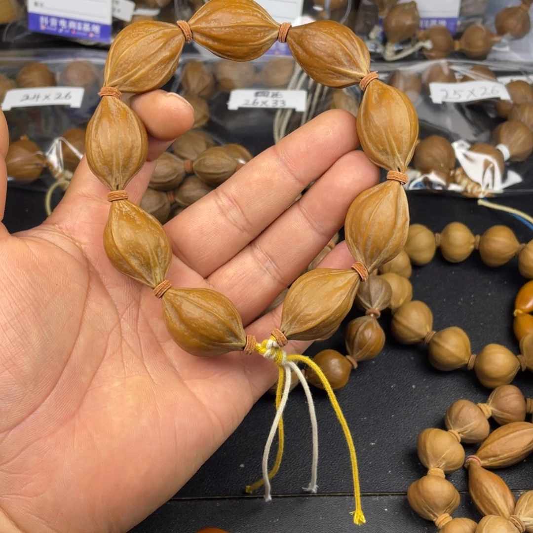 橄榄核手串红皮四花22mm