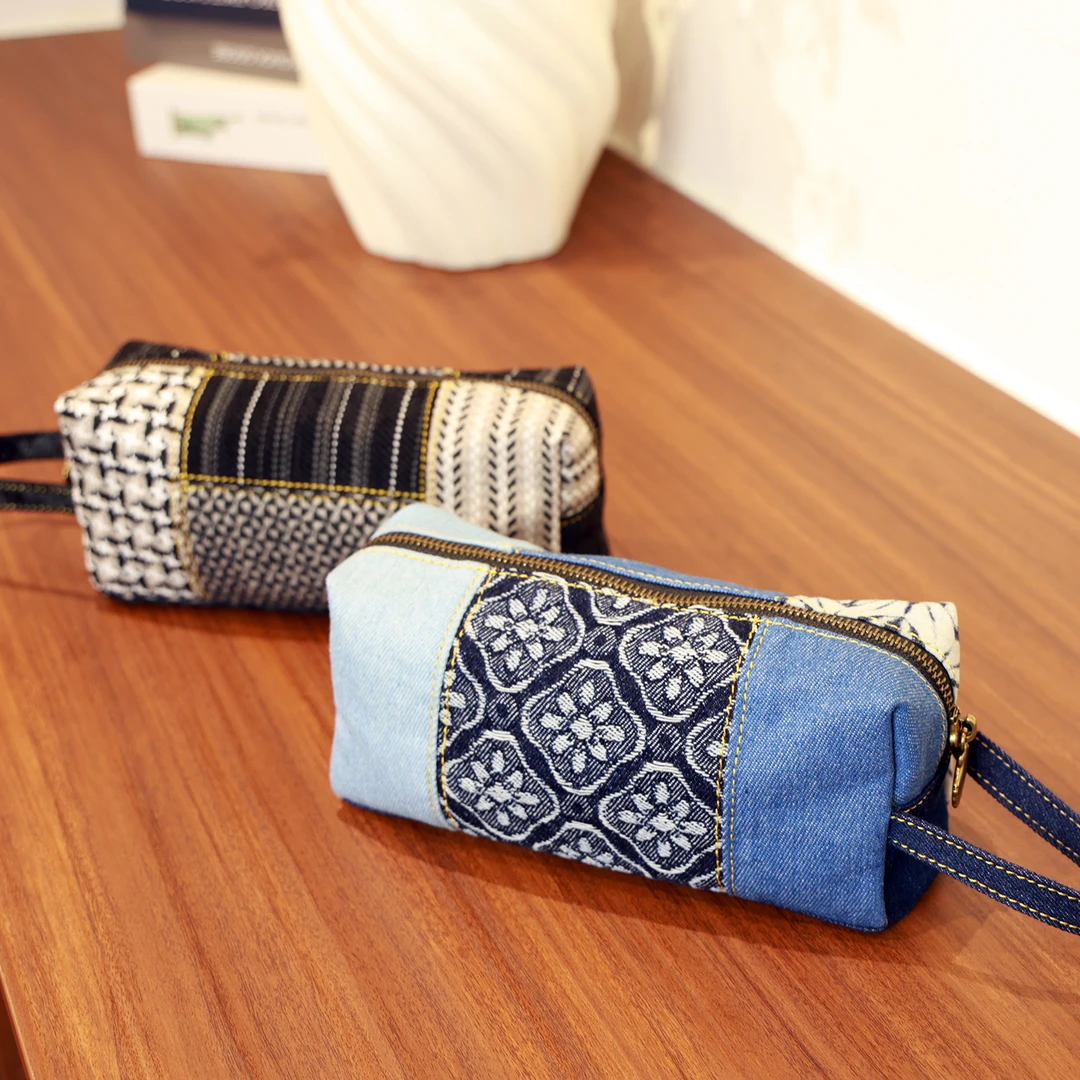 MILIAN/米丽安2025新款原创民族风拼接手拿包女款休闲便携手机包