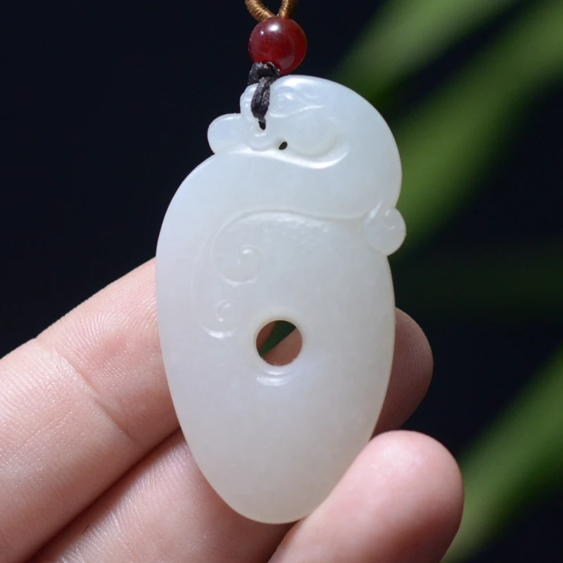 16.0g 新疆和田洒金皮油糯白玉籽料仿古龙