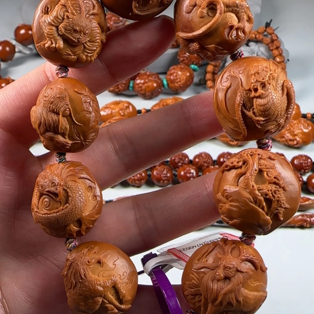 橄榄核核雕宽2.3梅林红核山海经瑞兽呈祥手串手持