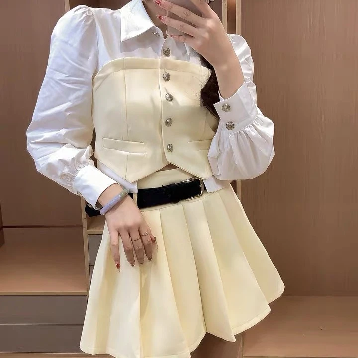 03323-A-2-2-3    时尚假两件马甲式衬衫领上衣+百褶半身裙两件套