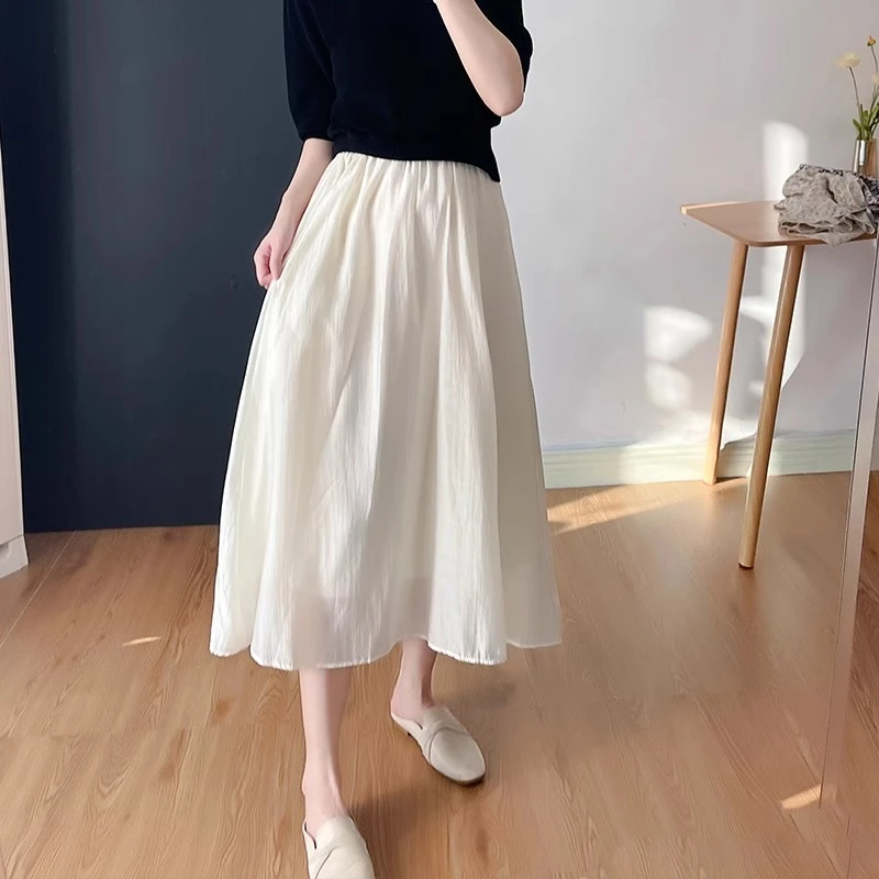 白色口袋垂感气质仙气半身裙高腰夏季松紧腰百搭a字显瘦中长裙