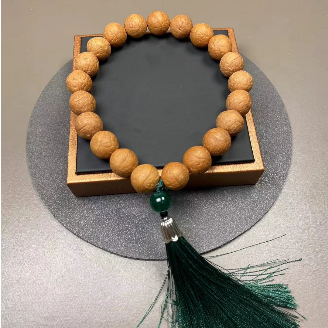 凤眼菩提手持，球圆果冻皮铁籽，尺寸14-15mm，年底下树头茬籽