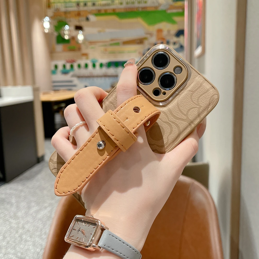 苹果14promax手机壳新款护腕简约皮纹山茶花女款iphone13/12/11